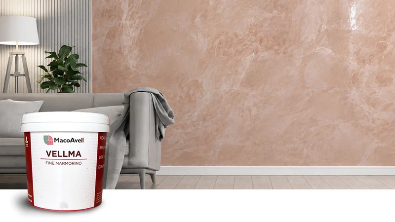 MacoAvell Vellma tub beside a pink marble-effect feature wall in a living-room product visual
