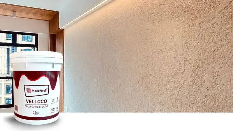 MacoAvell Vellcco tub beside a beige textured wall and window