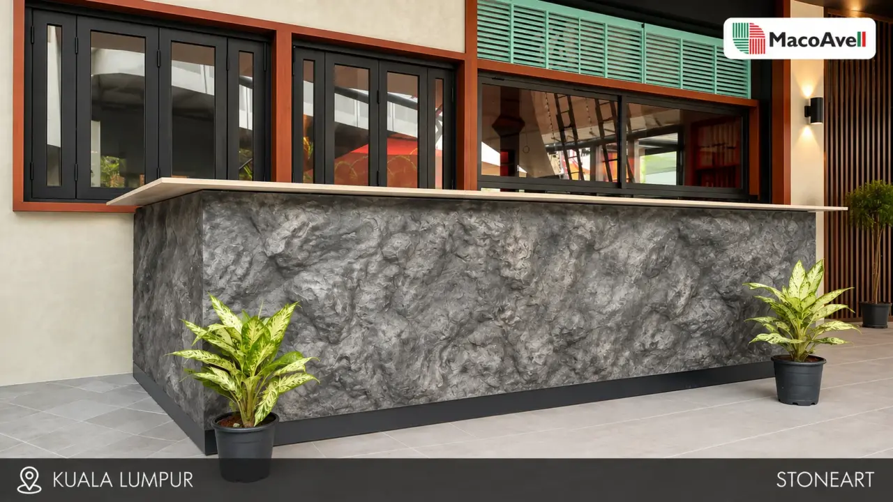 Grey StoneArt counter in Kuala Lumpur with a pale countertop, dark plinth and potted plants.