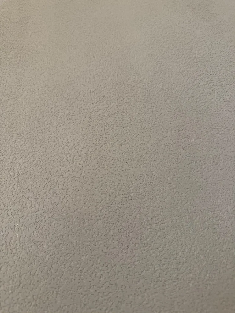 Vellcco Fine MA01 pitted-effect surface detail in softer light at the Kuala Lumpur project.