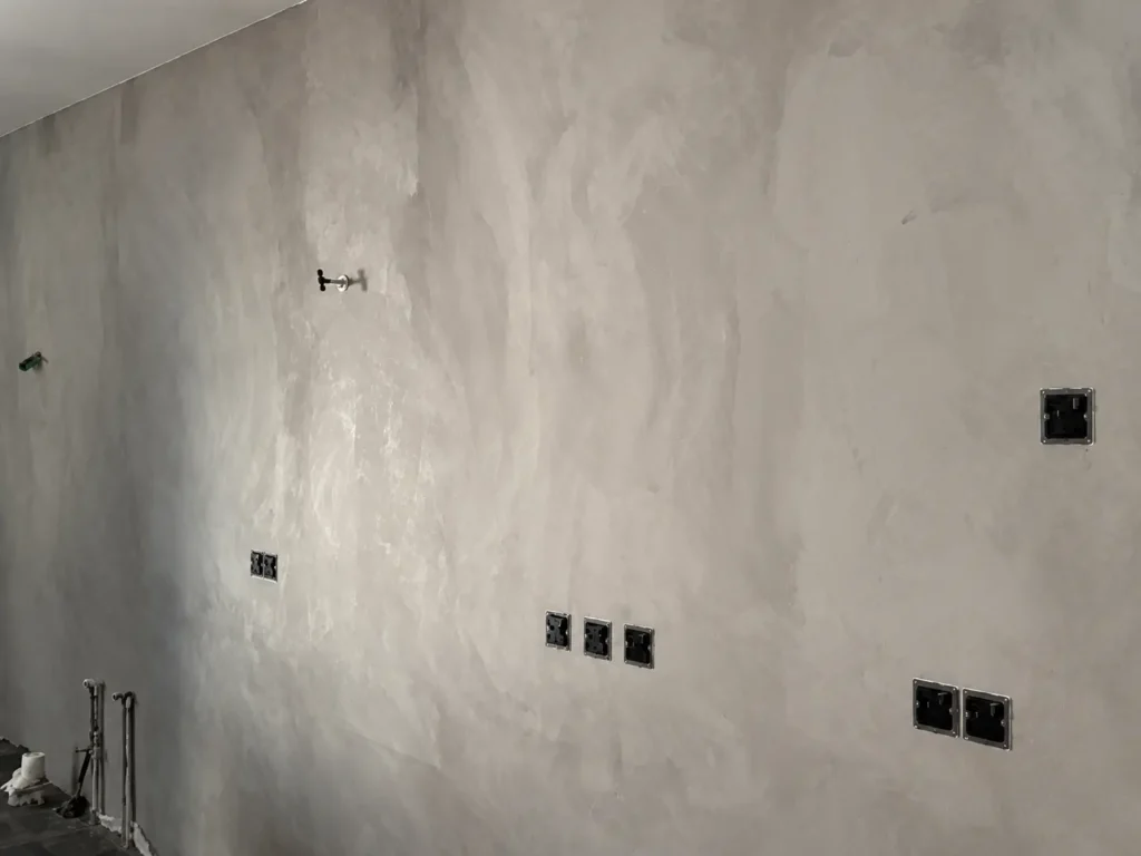 Soft grey tonal variation across a Vellplas MA02 wall at a Kuala Lumpur project during interior works.