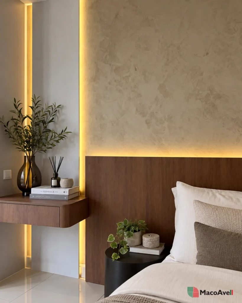 Bedside detail of Vellplas MA04 Light Warm Grey with layered texture, warm vertical lighting and a timber ledge in Kuala Lumpur.